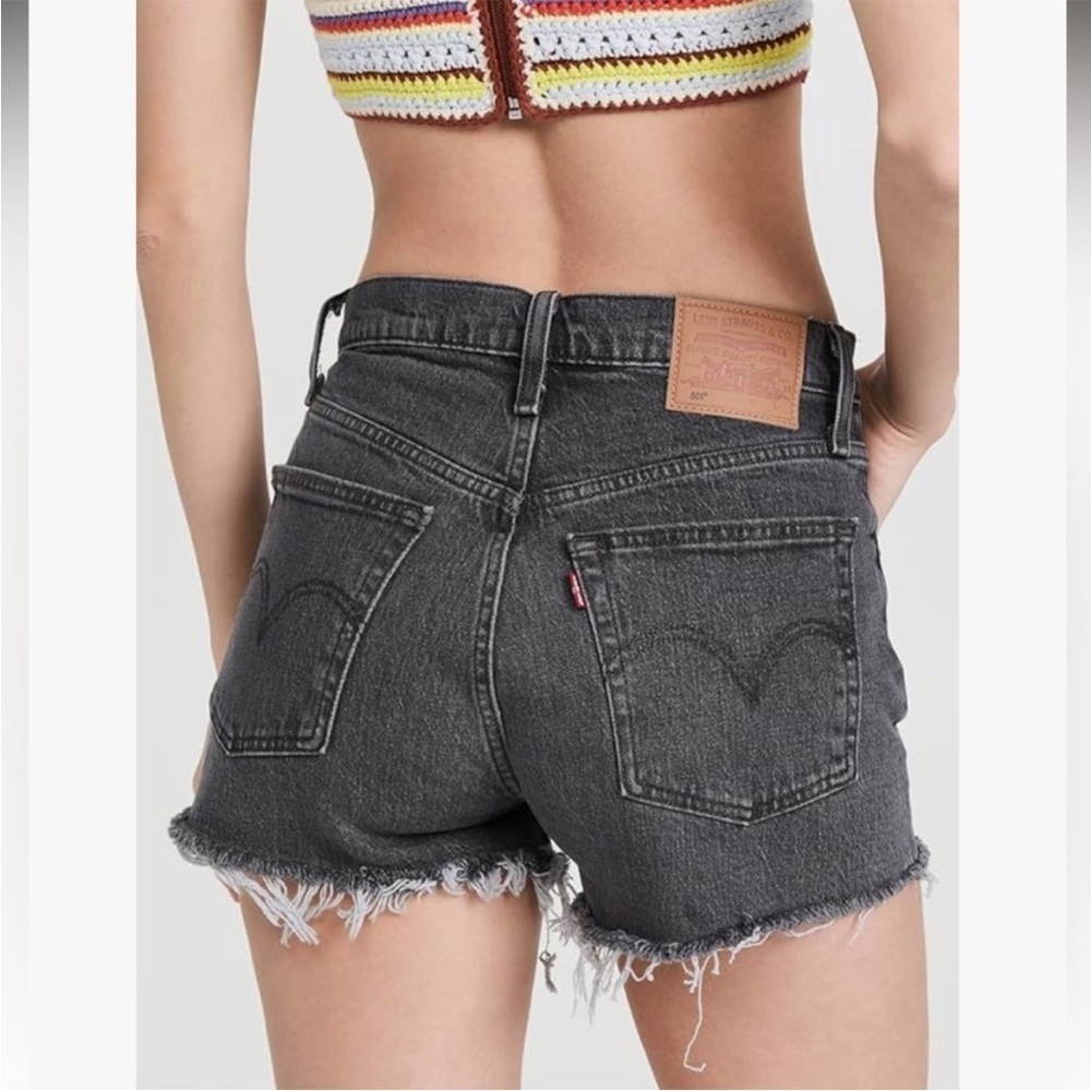 Levi's 501 Cut Off Raw Hem Button Fly Jean Shorts in Dark Gray. Size 26